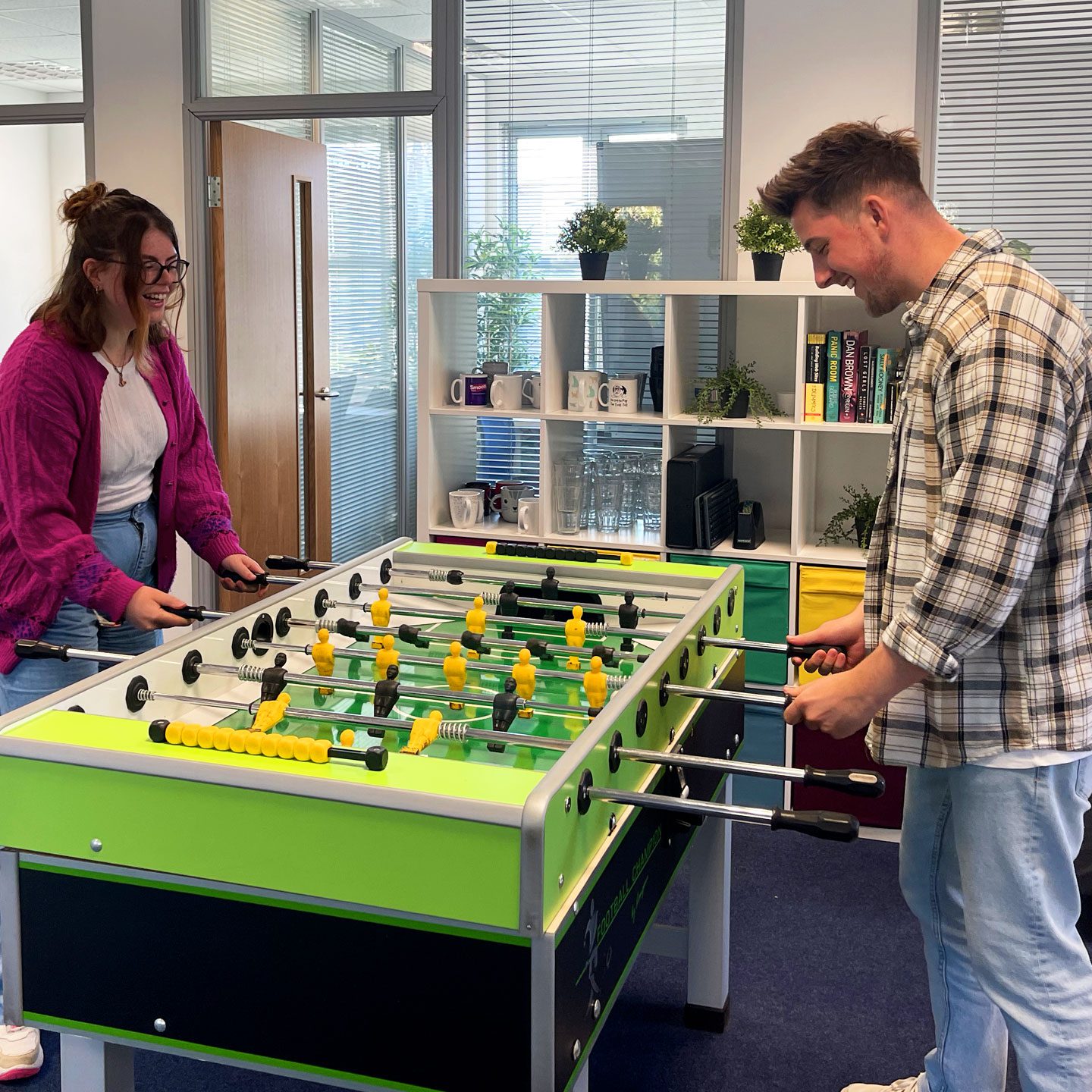 Bigg team. Connell and Ashleigh playing table football/foosball